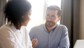 A man and woman discussing topic during a tutoring session